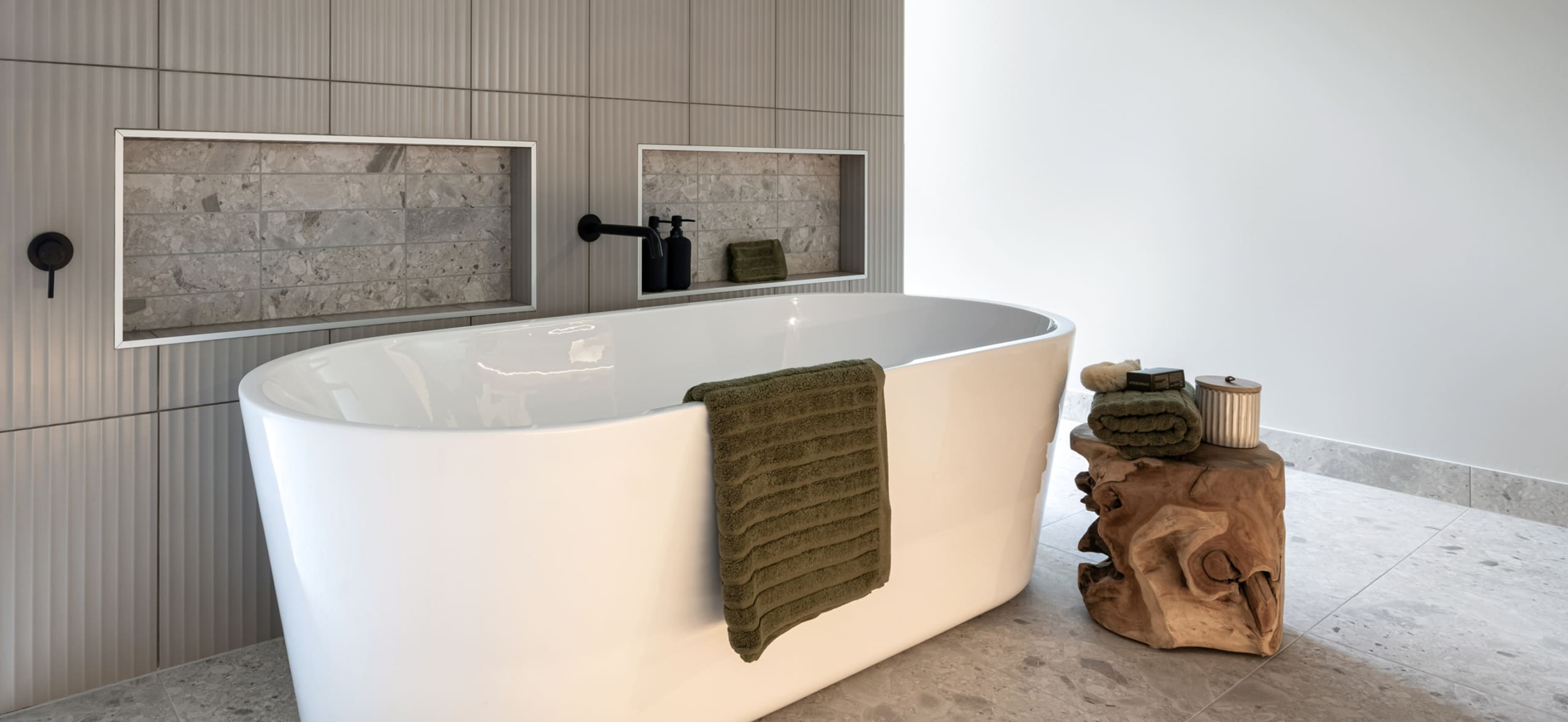 Modern bathroom with freestanding tub in a Davis Sanders home