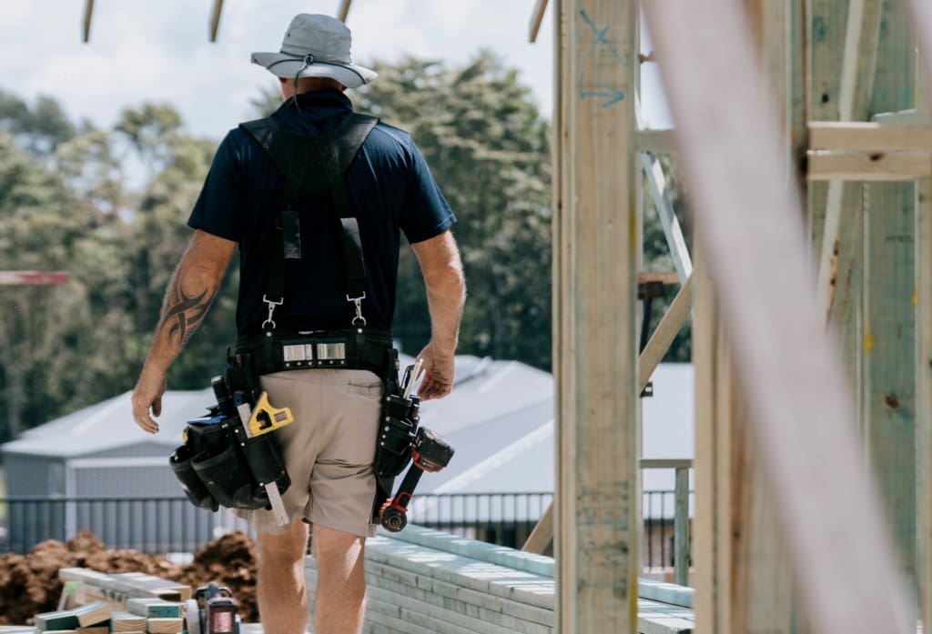 Construction worker walking through a Davis Sanders job site