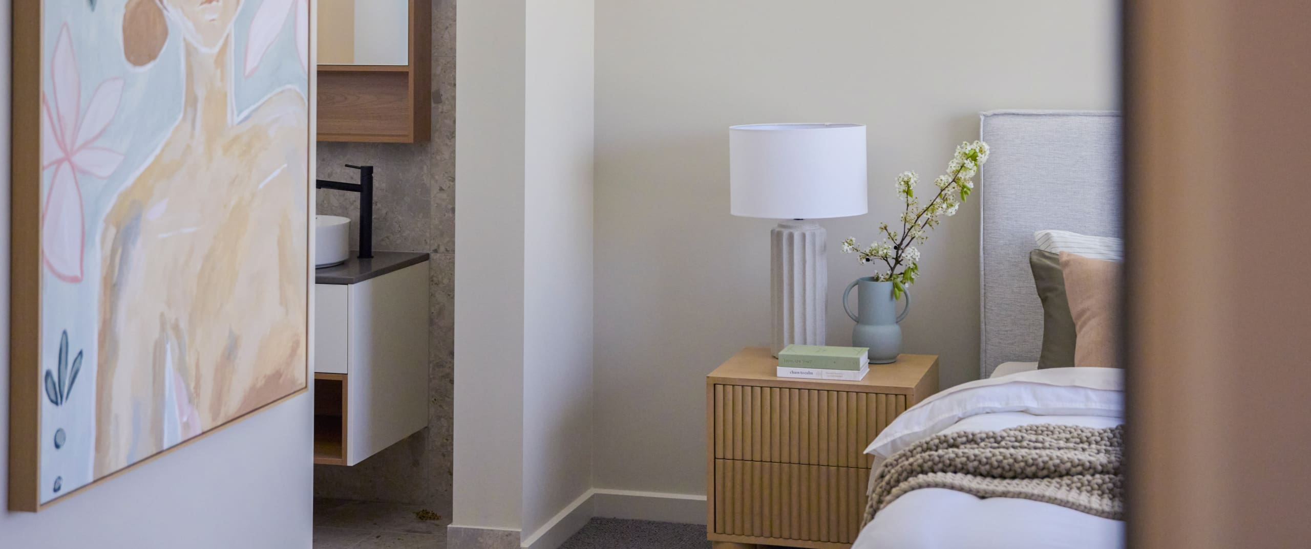 Modern bedroom with cosy neutral design in a Davis Sanders display home